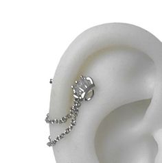 a white ear with a chain attached to it's middle part, on a white background