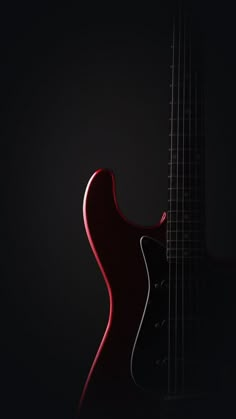 an electric guitar is shown against a black background