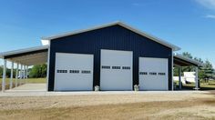 two garages are shown in front of a blue building with white doors and windows