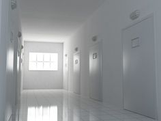 an empty white room with two doors and one light coming from the far end in it