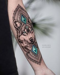 a person with a wolf tattoo on their arm