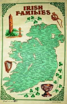 the irish map with shamrocks on it and other items around it, including an irish flag