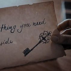 a person holding a piece of paper with writing on it that says, nothing you need is inside