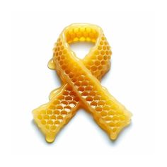 a honeycomb ribbon shaped brooch on a white background