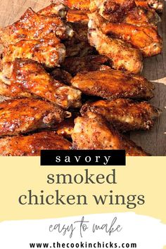 some chicken wings are on a cutting board with the words savory smoked chicken wings easy to make