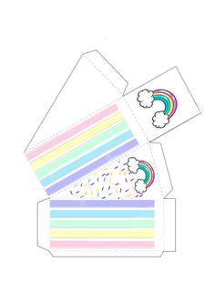 an open box with rainbows and clouds on the side, cut out from paper