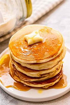 a stack of pancakes with butter on top