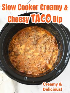 the slow cooker creamy and cheesy taco dip is ready to be eaten