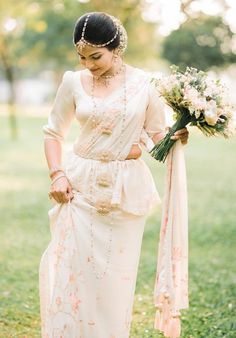 a woman in a white dress holding a bouquet