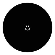 a black circle with a smiley face on it