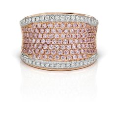 This enchanting ring showcases a pair of brilliant round Argyle pink diamonds, totaling 1.17 carats, nestled within a precious 18KT pink gold setting. These rare and exquisite Argyle pink diamonds are perfectly complemented by 0.45 carats of brilliant round white diamonds, adding a captivating sparkle to the design on Pink Diamond Cut Diamond Ring, Luxury Pink Diamond Ring With Single Cut Diamonds, Pink Diamond Rings With Diamond Cut, Pink Luxury Diamond Ring With Diamond Accents, Luxury Pink Brilliant Cut Rings, Luxury Pink Rings With Brilliant Cut, Luxury Pink Brilliant Cut Diamond Ring, Luxury Pink Diamond Ring With Diamond Accents, Luxury Pink Diamond Ring With Brilliant Cut