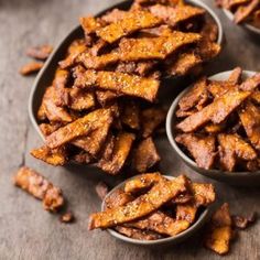 three bowls filled with sweet potato strips on top of a wooden table