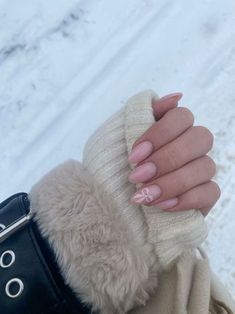 Nails Winter 2025 Trends, Classy Pink Nail Designs, Almond Nails Aesthetic Winter, Almond Nails Bow Design, Pink Nails Minimalist, Glitter Bow Nails, Nude Nails With Bow, Winter Nail Inspo Almond, Christmas Coquette Nails