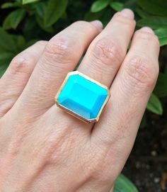 "A genuine large rectangular-shaped faceted Blue Turquoise, Robins Egg Blue Hue aka Sleeping Beauty, set on a minimalist bezel is a great statement/cocktail ring. Made to order in your choice of metal 14k Yellow Gold, Rose Gold or White Gold FINAL SALE Instagram Video ----------------- https://instagram.com/p/BiXzeTqlqIb/ https://instagram.com/p/Biuu4QnFZmJ/ https://instagram.com/p/BjstMbtlEEW/ Face measure 16mmx 18.7mm Shank width 3.5mm Sits off the finger 5.7mm ----> Please note there is an Formal 14k Gold Turquoise Blue Ring, Blue Rectangular Faceted Jewelry, Turquoise Emerald Cut Gemstone Jewelry, Blue Square Cut Gemstone Jewelry, Emerald Cut Turquoise Gemstone Jewelry, Blue 14k Gold Jewelry With Rectangular Stone, 14k Gold Jewelry With Blue Rectangular Stone, Rectangular Turquoise Gemstone Ring, Turquoise Gemstone Rings With Emerald Cut