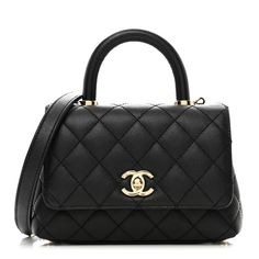 This is an authentic CHANEL Caviar Quilted Extra Mini Coco Handle Flap in Black. This stylish and classic tote is crafted of diamond-stitched grained caviar leather in black. The shoulder bag features a rear patch pocket, rolled leather top handle, a leather-threaded gold chain-link shoulder strap, and a gold CC turn-lock closure. The flap opens to a partitioned burgundy leather interior with a zipper and pocket. Luxury Caviar Leather Evening Bag, Designer Caviar Leather Bags For Formal Occasions, Black Caviar Leather Evening Bag, Classic Formal Caviar Leather Bag, Luxury Caviar Leather Bag For Everyday, Everyday Luxury Caviar Leather Bag, Elegant Bag In Textured Caviar Leather, Elegant Bags In Textured Caviar Leather, Elegant Textured Caviar Leather Bag