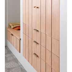 a wooden cabinet with many drawers and handles