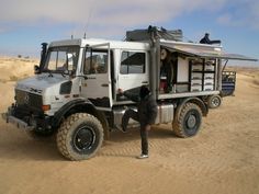 the truck is parked in the middle of the desert