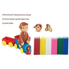 the monkey toy is next to many different colored pencils and some are in front of it