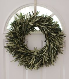 a wreath is hanging on the front door