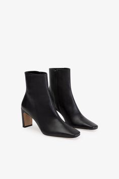 FINAL SALE - NO RETURNS, EXCHANGES, OR STORE CREDITThe sleek, modern look of our Dorset Narrow Heel Boots will set her apart from any other shoe in your collection. She's been handcrafted from smooth Italian leather with a chic square toe and monochrome zip. Set on a slim rectangular heel, she looks just as good paired with jeans as she does with dresses. | Astrid is shown wearing the Dorset Narrow Heel Boots in black, in lavender, and in sand. The heel is approximately 3" (7.7 cm) in height. So Black Dress Boots, Heels Aesthetic, Minimalist Closet, Work Shoes Women, Black Heel Boots, Simple Chic, Only Shoes, Work Week, Winter Clothing