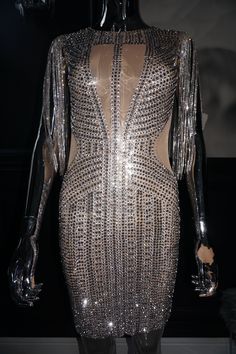 Light up the room when you put this dress on! It is mesh with silver stones and allows the cleavage part to show through the mesh and waist. There is silver rhinestone fringe hanging from the shoulders. Length will vary depending on height. There is a zipper in the back giving it that tighter fit. Item is true to size! It's a must-have, hurry and purchase! Item not customizable. Rhinestone Fringe, Jumpsuit Jacket, Leggings Sale, Maxi Gowns, Bustier Top, Crop Top Blouse, Silver Rhinestone, Plus Size Jeans, Jean Leggings