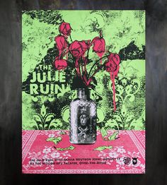 a poster with flowers in a vase on a table