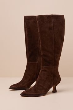 Exceptionally chic and versatile, there is no limit to the amount of trendy looks you'll create with the Dolce Vita Auggie Wide Calf Dark Brown Suede Pointed-Toe Knee-High Boots! Soft genuine suede leather shapes these essential fall boots that feature a classic pointed-toe upper that rises to a 15.75"" knee-high shaft with 16.5"" circumference. Elastic gusset and 16.5"" zipper at the instep. A cute sculpted heel completes the sophisticated design. 2. 5" sculpted heel. Lightly cushioned insole. Brown Heel Boots, Dark Brown Suede Boots, Brown Heeled Boots, Fall Boots, Brown Suede Boots, Boots Suede, Wide Calf Boots, No Limit, Wide Calf