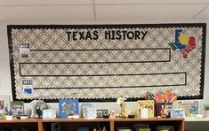 the texas history bulletin board is displayed in front of bookshelves and desks