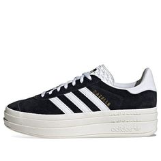 The adidas Gazelle Bold 'Black White' is the perfect sneaker for any occasion. With its iconic silhouette, this sneaker is crafted from buttery soft leather with a three-stripe detail for a sporty feel. It's stacked three layers high for a fresh perspective on the classic style. Suitable for adults, this sneaker is perfect for any activity, from running to casual outings. Inspired by the 70s, the Gazelle is a timeless classic that is still beloved today. Get your hands on this stylish sneaker an Sporty Adidas Platform Sneakers With Round Toe, Sporty High-top Adidas Platform Sneakers, Adidas High-top Platform Sneakers With Logo, Adidas Platform Sneakers With White Sole And Round Toe, Adidas Logo Low-top Synthetic Platform Sneakers, Sporty Adidas Platform Sneakers, Adidas Synthetic Sneakers With Three Stripes, Adidas Low-top Platform Sneakers, Adidas Sporty Platform Sneakers With White Sole