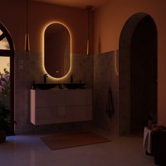 a bathroom with two sinks and a large mirror on the wall next to an arched doorway