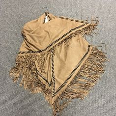 Swede like western fringe shawl in two colors brown and grey one size. Brown Fringe One Size Poncho, Brown One Size Poncho With Fringe, One Size Brown Fringe Poncho, Brown Fringed Poncho For Fall, Brown Fringe Poncho For Fall, Beige Fringe Poncho For Fall, Winter Fringe Scarves Shawl, Winter Fringe Shawl Scarves, Winter Fringe Shawl Scarf