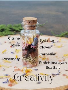 Creativity spell jar photo with labels of what is inside- Citrine, sodalite, rose, cloves, carnelian, Rosemary, pink Himalayan sea salt Crystal Jars Decor, Success Spell Jar Recipe, Beauty Spell Jar Recipe, Mini Spell Jars Diy, Things To Put In Jars, Witch Jars Spells, Simple Spell Jars, Spell Jar Ideas, Creativity Spell Jar