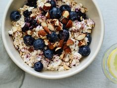 a bowl of oatmeal with blueberries and almonds