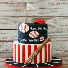 a baseball themed birthday cake with a bat and ball on the top, sitting on a wooden table