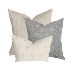 three pillows with different patterns on them