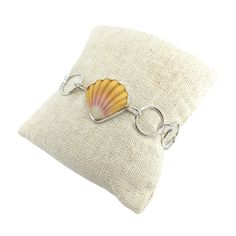 This gorgeous yellow sunrise shell has been bezel set into sterling silver on a sturdy handmade sterling silver chain. This bracelet measures at approximately 6 3/4in. This bracelet is ready to ship! Have your own special Sunrise Shell? I would love to create a custom bracelet for you! It is considered very lucky to find a sunrise shell as they are rare and endemic to Hawaii and often found only at great depths. This shell was found on a beautiful beach on Kauai, no shells are ever picked alive. Trendy Silver Shell Jewelry With Oyster Bracelet, Silver Shell Bracelets Gift, Yellow Sunrise, Peace Sign Ring, Gold Oval Ring, Peace Ring, Sunrise Shell, Circle Chain, Hippie Rings