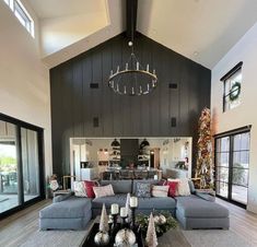 a living room filled with furniture and christmas decorations