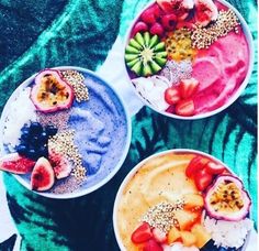 three bowls filled with different types of food