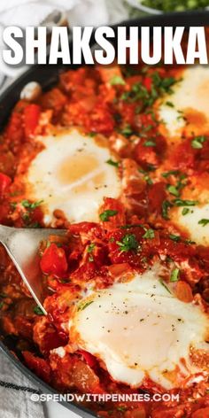 a skillet filled with eggs and tomato sauce