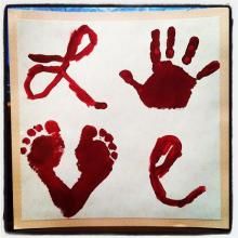 four handprints made to look like red hands and feet