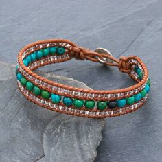 Thai artisan Siriporn creates this pretty bracelet with enhanced blue and green serpentine and petite clear glass beads. The beads are knotted on brown leather cords in three rows. The bohemian-chic bracelet fastens at one of two lengths with a hammered 950 silver button. Chic Bracelet, Beaded Cuff Bracelet, Wristband Bracelet, Beaded Cuff, Leather Bracelets, Pretty Bracelets, Silver Buttons, Bead Leather, Bohemian Chic