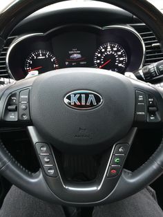 the dashboard of a car with gauges and steering wheel controls in it's center console