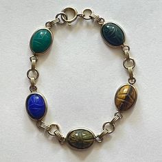 12k Gold Filled Bracelet Vintage Egyptian Revival Beetle 5 Carved Scarab Gemstones Onyx, Blue And Green Chalcedony, Tiger Eye Stones Length About 7 Inches Scarab Bracelet, Green Chalcedony, Egyptian Revival, Tiger Eye Stone, Bracelet Vintage, Tiger Eye, Womens Jewelry Bracelets, Gold Filled, Onyx