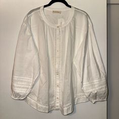 Lucky Brand Womens Boho Blouse Shirt Full Button Front Closure Regular Length Wrist Length Sleeves With Elastic Cuffs Lace And Striping On Sleeves Lace Stripping Embellishment Throughout Crew Rounded Neckline Solid White Semi Sheer Size Large Nwt Msrp: $89.50 Measurements All Measurements Are Approximate And Photographed Armpit To Armpit: 24” Armpit To Bottom Hem: 11.5” Armpit To Sleeve Hem: 17” 100% Cotton Machine Wash Cold; Tumble Dry Low Smoke Free, Cat Friendly Home Tags: Boho, Bohemian, Cot Cotton Blouse With Button Closure For Daywear, Cotton Tops With Buttons For Daywear, Cotton Blouse With Button Cuffs For Daywear, White Bohemian Blouse With Button Closure, Bohemian Tops With Button Closure And Relaxed Fit, White Cotton Blouse With Buttons, Cotton Peasant Blouse For Daywear, Summer Cotton Blouse With Covered Buttons, Relaxed Fit Daywear Blouse With Buttons