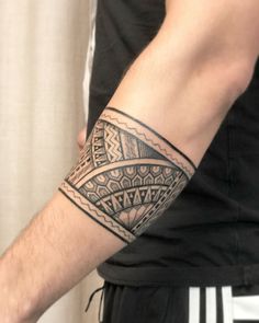 a man with a tattoo on his arm