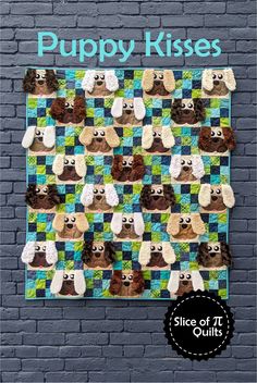 the puppy kisses quilt pattern is displayed on a brick wall with blue and green background