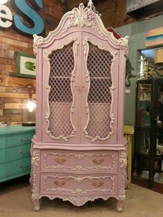 an old pink china cabinet in a store