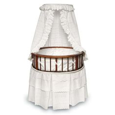 a baby crib with a white canopy over it