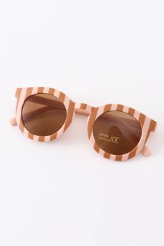 Let your little one look stylish and stay protected with these groovy retro round sunglasses! The UV400 lenses block the sun’s harmful rays, while the funky shape is sure to turn some heads. For the coolest of kids, only! Frame width: 5” temple length:5” Kids Only, Bubble Necklaces, Groovy Retro, Pajama Romper, Retro Stripes, Boy Accessories, Smocked Dress, Retro Sunglasses, Knee High Socks