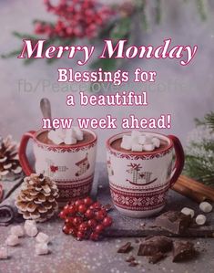 two mugs with marshmallows and pine cones on them are sitting in front of the words merry monday blessing for a beautiful new week ahead